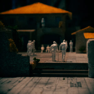 Fotografie: Macro-Aufnahme, zwei kleine Figuren in einem Architektur-Modell.